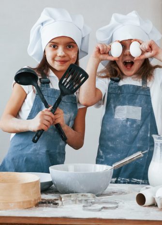 Two,Little,Girls,In,Blue,Chef,Uniform,Have,Fun,While